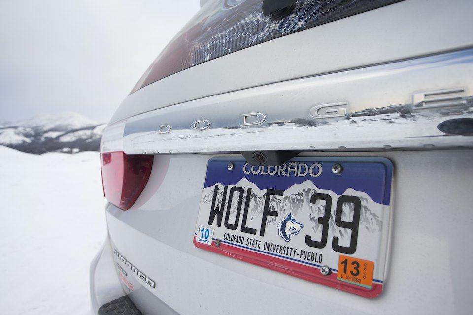 Car with number plate indicating support for wolves in Yellowstone National Park, USA Car with number plate indicating support for wolves in Yellowstone National Park, USA