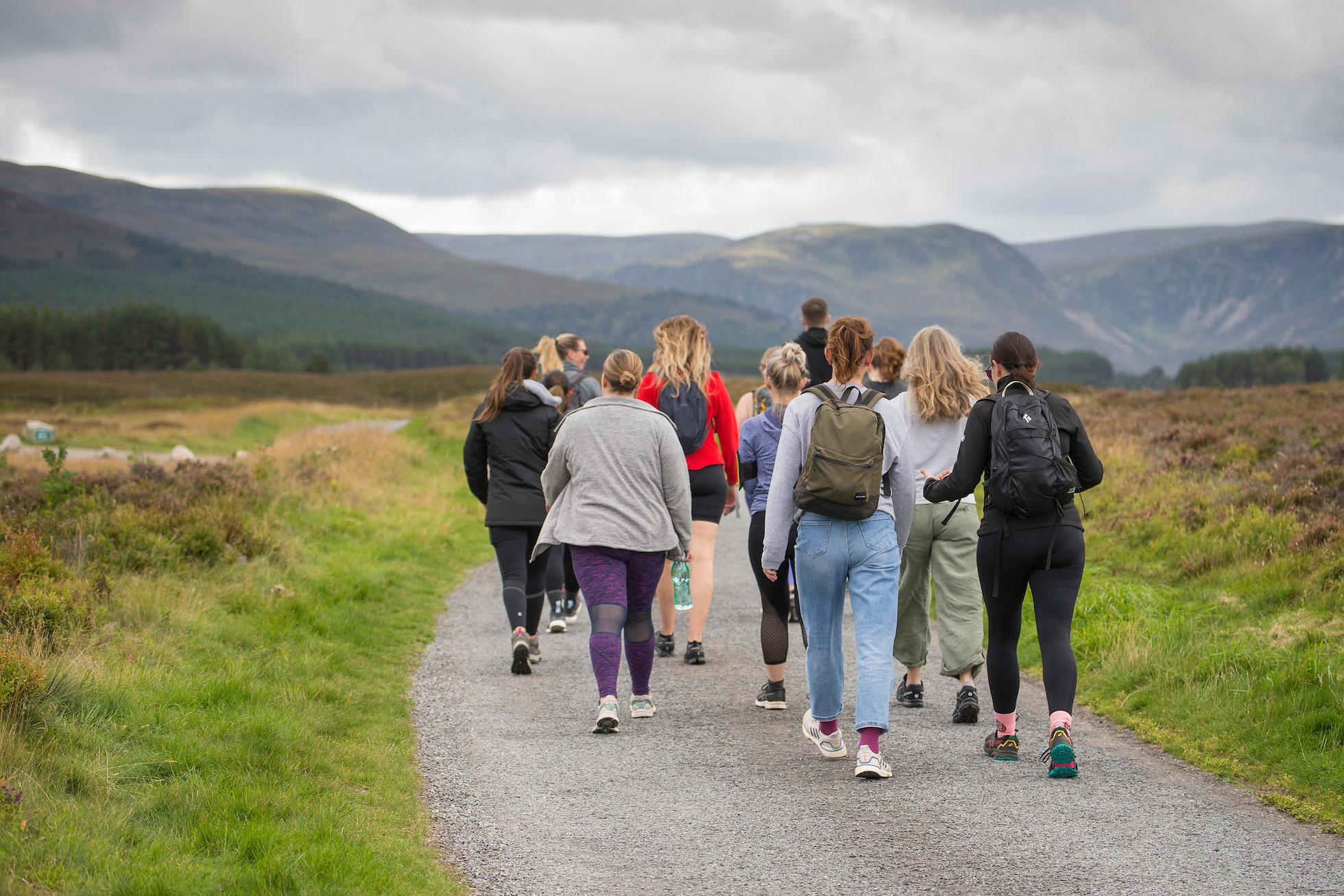 Group of young women walking in the Cairngorms National Park, Scotland.